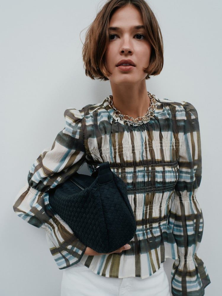 Next Sees Record Christmas Sales, Boosting Full-Year Forecasts